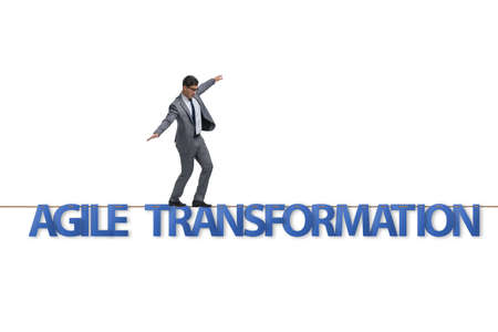 Agile transformation concept with businessman walking on tight ropeの写真素材