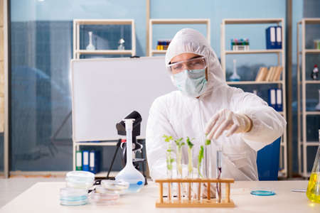 Male biotechnology scientist chemist working in the lab