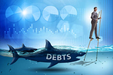 Businessman successfully dealing with loans and debtsの写真素材