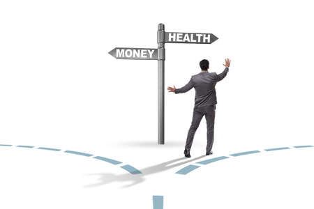 Businessman choosing between money and healthの写真素材