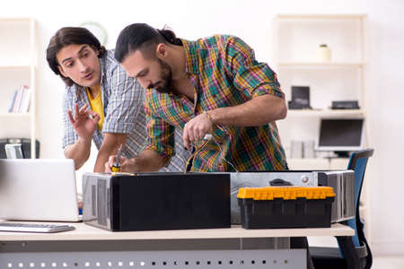 IT engineers working on hardware issueの写真素材