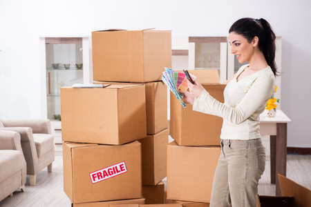 Young woman moving to new flat