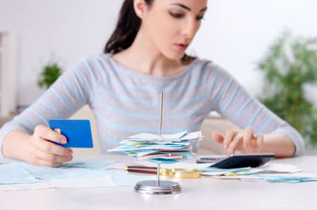 Young woman in budget planning conceptの写真素材