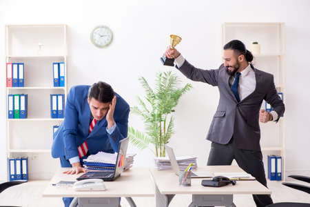 Two male colleagues in the officeの写真素材