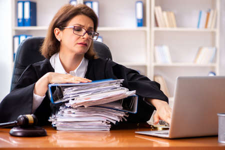 Middle-aged female doctor working in courthouse