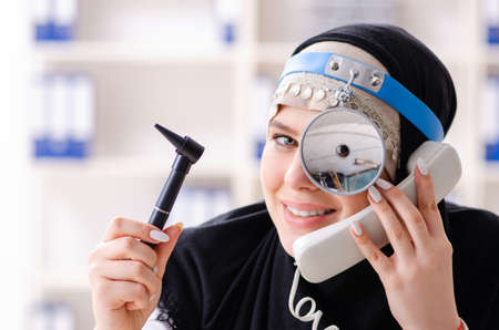 Young doctor in hijab working in the clinic