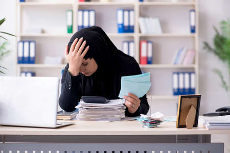 Female employee bookkeeper in hijab working in the officeの写真素材