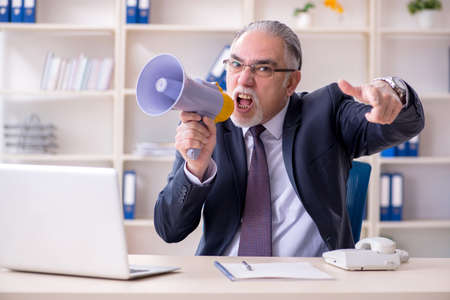 White bearded old businessman employee unhappy with excessive woの写真素材