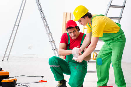 Injured worker and his workmateの写真素材