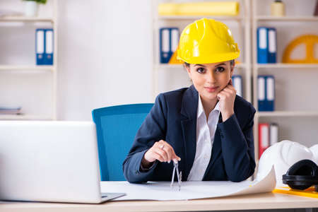 Young female architect working in the officeの写真素材