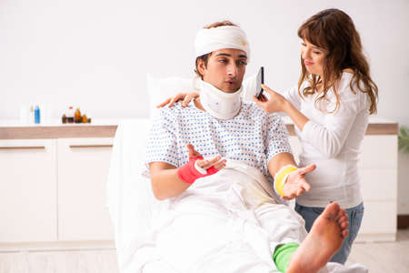 Loving wife looking after injured husband