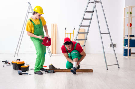 Injured worker and his workmateの写真素材