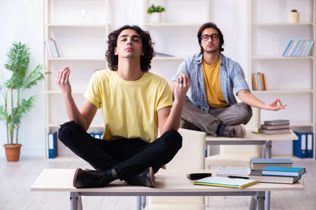 Two male students in the classroomの写真素材