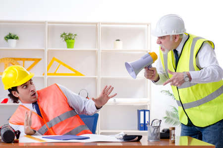 Two engineers colleagues working under project