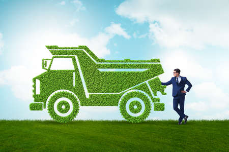 Businessman with green ecological vehicleの写真素材