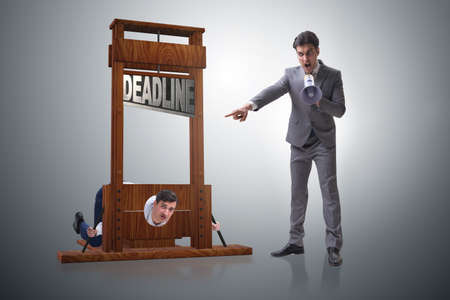 Businessman in deadline concept with guillotineの写真素材