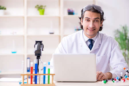 Young male scientist working in the lab
