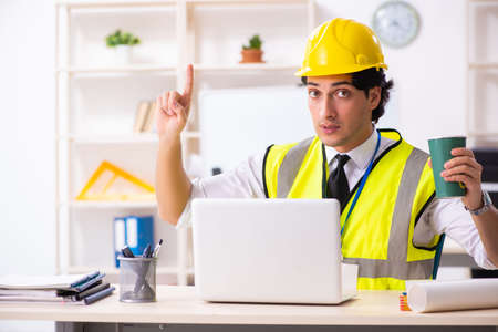 Male construction engineer working in the office
