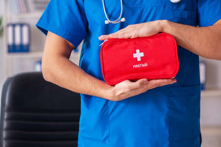 Male doctor with first aid bagの写真素材