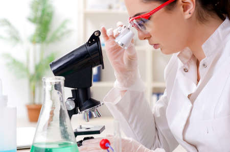 Young female chemist working in the labの写真素材