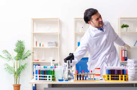 Young male chemist working in the labの写真素材