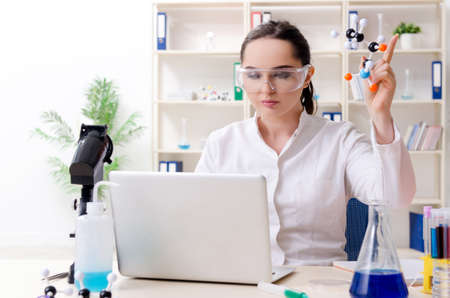 Young female chemist working in the labの写真素材