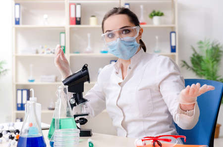 Young female chemist working in the labの写真素材