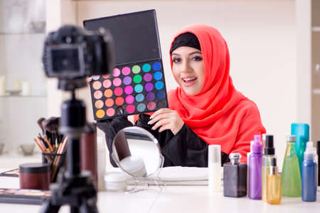 Beauty blogger in hijab recording video for her blog