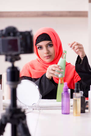Beauty blogger in hijab recording video for her blogの写真素材