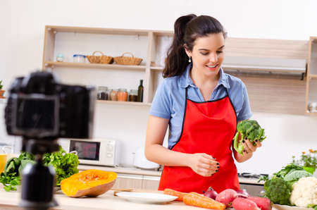 Young female vegetarian recording video for her blog