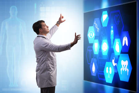 Doctor in telemedicine concept looking at screen