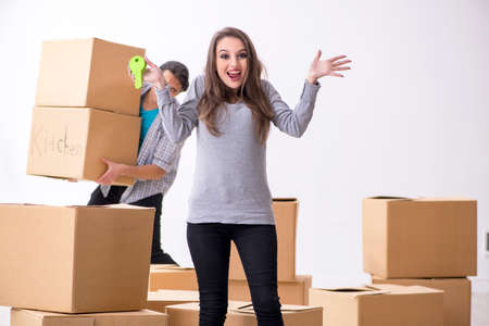 Young pair moving to new flatの写真素材