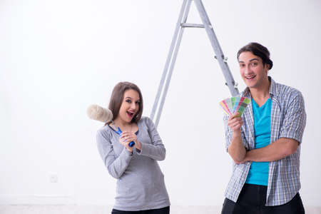 Young family doing renovation at homeの写真素材