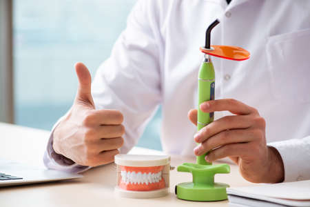 Male doctor stomatologist working in the clinicの写真素材