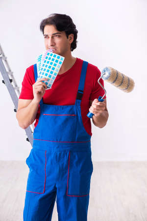 Young handsome contractor working indoorsの写真素材