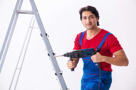 Young handsome contractor working indoorsの写真素材