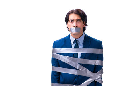 Tied employee with tape on mouth isolated on whiteの写真素材