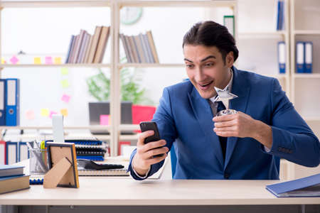 Young handsome employee in the officeの写真素材