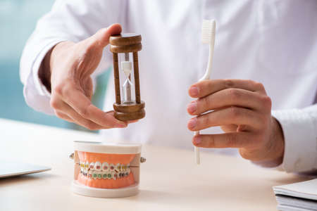 Male doctor stomatologist working in the clinic