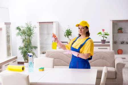 Old female contractor doing housework