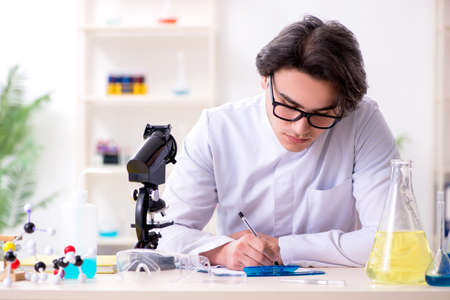 Young male biochemist working in the labの写真素材