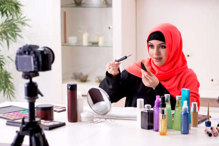 Beauty blogger in hijab recording video for her blogの写真素材