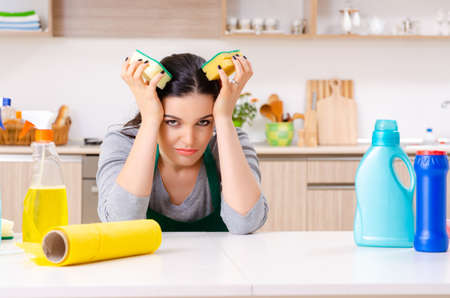 Young female contractor doing houseworkの写真素材