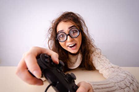 Funny nerd girl working on computer
