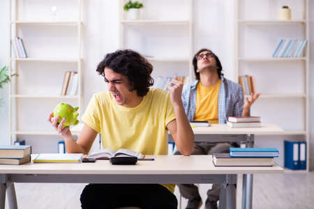 Two male students in the classroomの写真素材