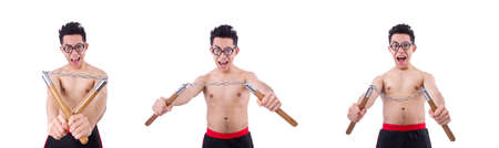 Funny guy with nunchucks on whiteの写真素材
