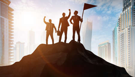 Businessmen in achievement and teamwork conceptの写真素材