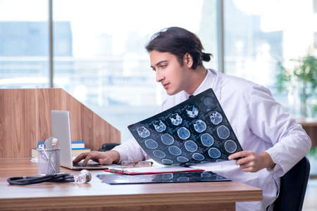 Young male doctor radiologist working in the clinic