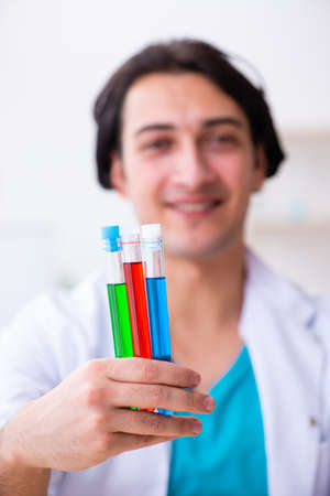 Young male chemist working in the labの写真素材