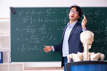 Young male math teacher and student skeletonの写真素材